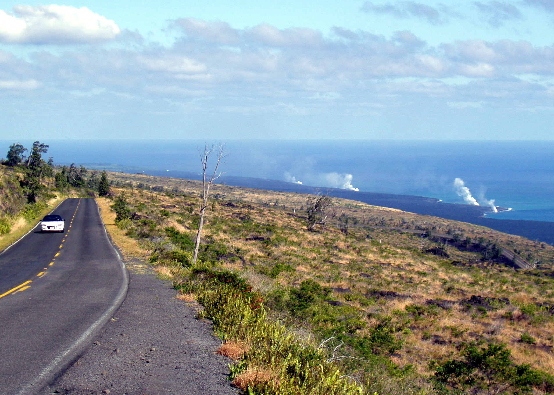 Lava flowing into the ocean in Hawaiʻi Volcanoes National Park, used for park access and volcano coverage.