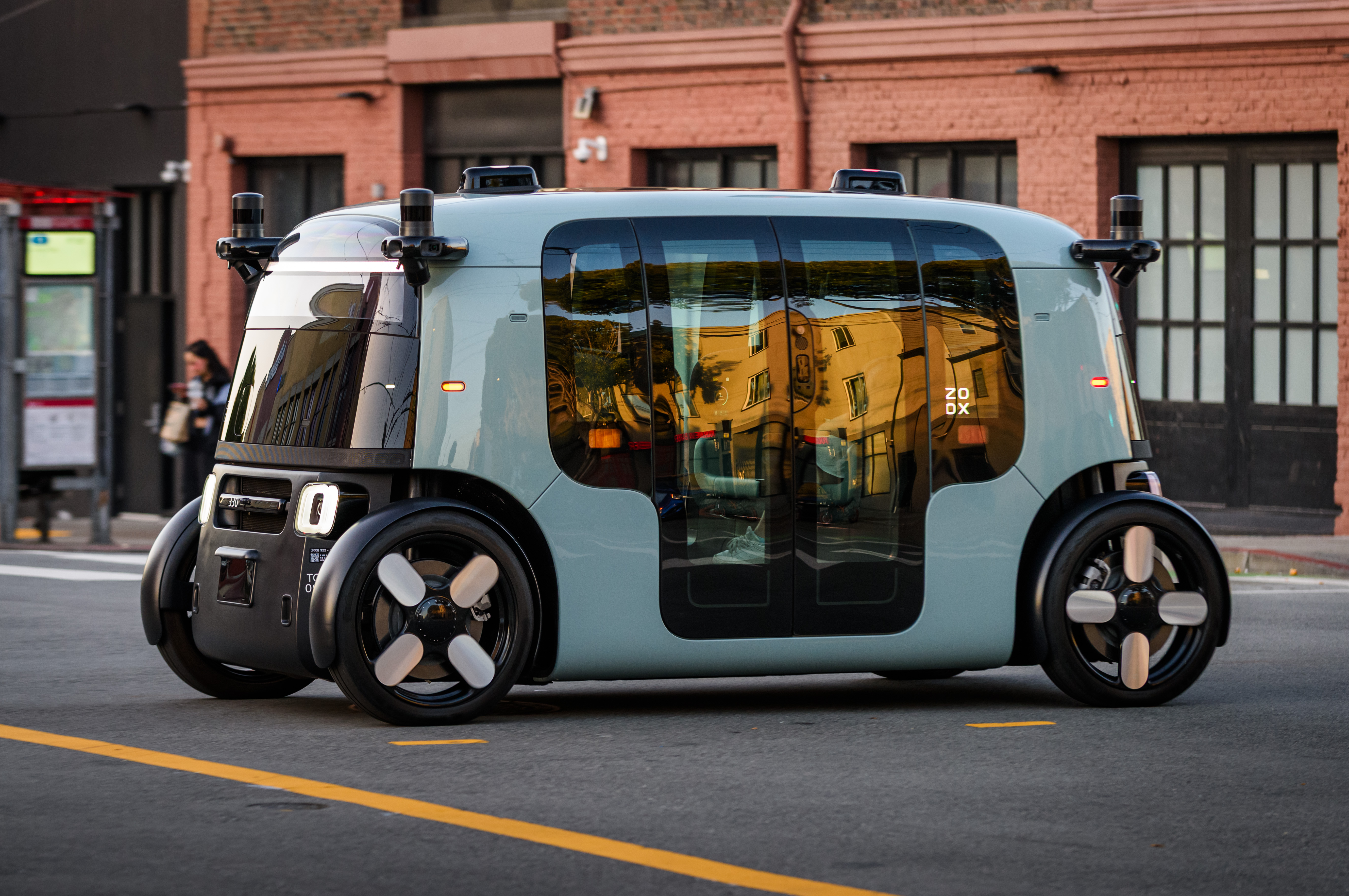 Photo of a Zoox robotaxi on a San Francisco street used for editorial coverage of the company's smoke-scene software recall.